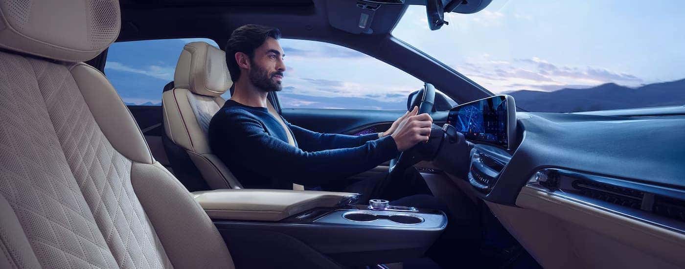 A man driving a 2025 Cadillac LYRIQ