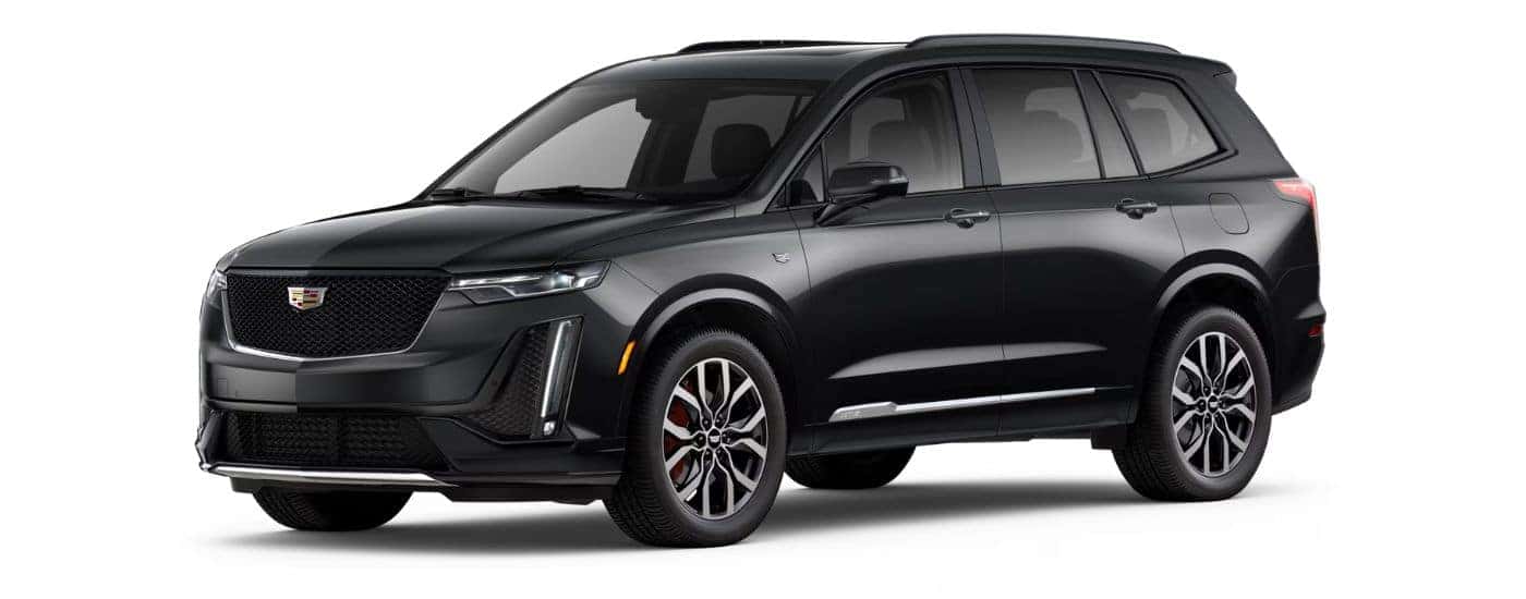A black 2023 Cadillac XT6 Sport angled left.