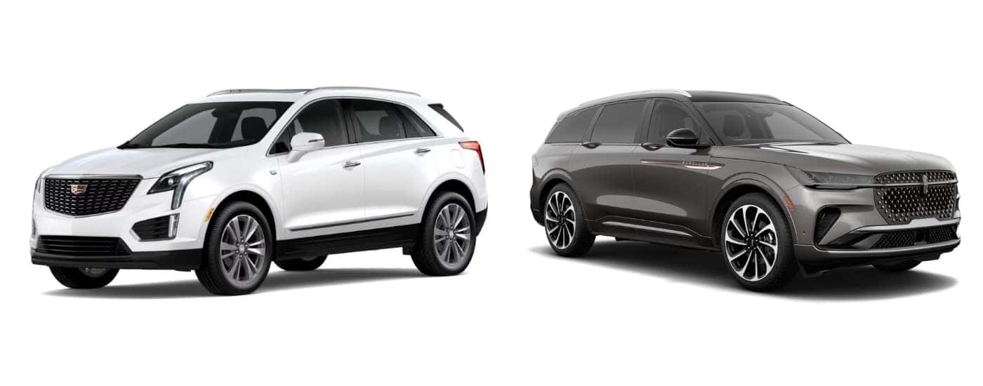 A white 2024 Cadillac XT5 angled left and a grey 2024 Lincoln Nautilus angled right.