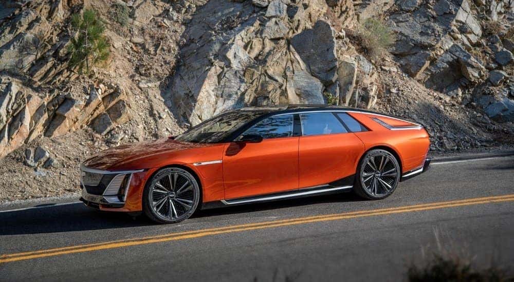 An orange 2026 Cadillac CELESTIQ from the side.