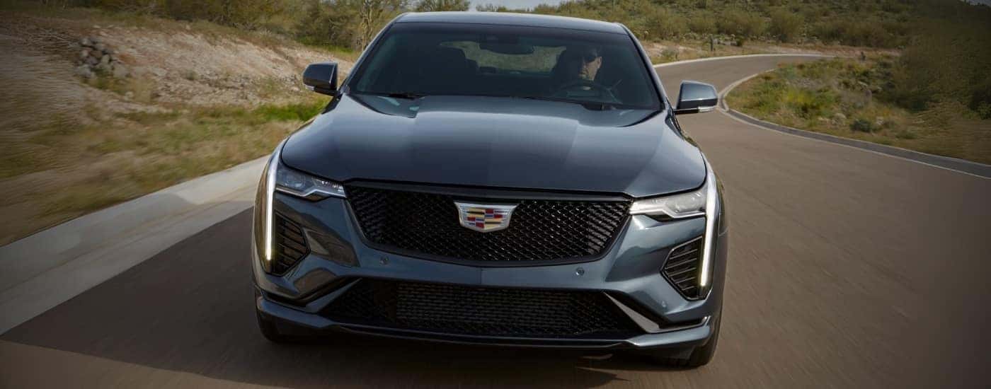 A blue 2021 Cadillac CT4-V is shown from the front.