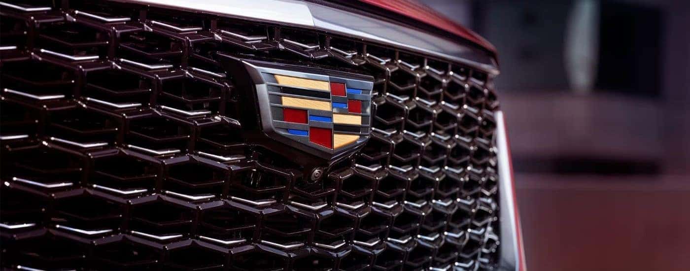 A close up shows the grille on a red 2024 Cadillac XT4 for sale.