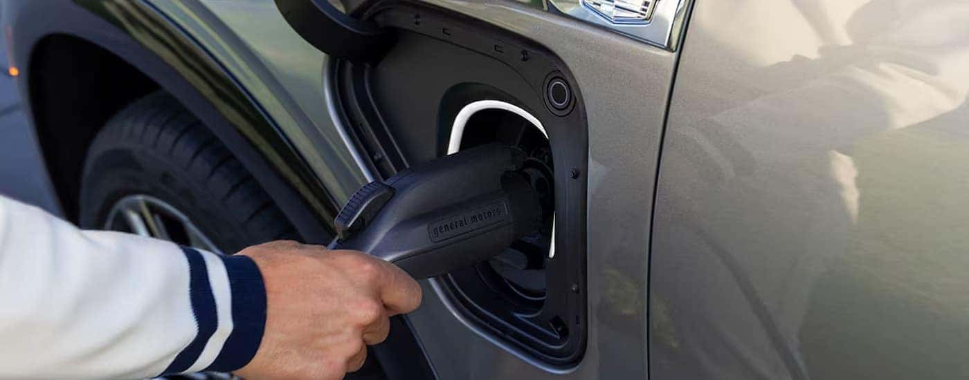 A 2025 Cadillac VISTIQ plugged in to charge