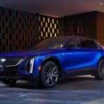 A blue 2026 Cadillac LYRIQ parked on a driveway.