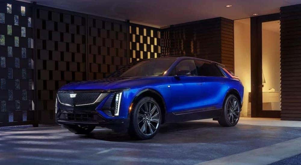 A blue 2026 Cadillac LYRIQ parked on a driveway.