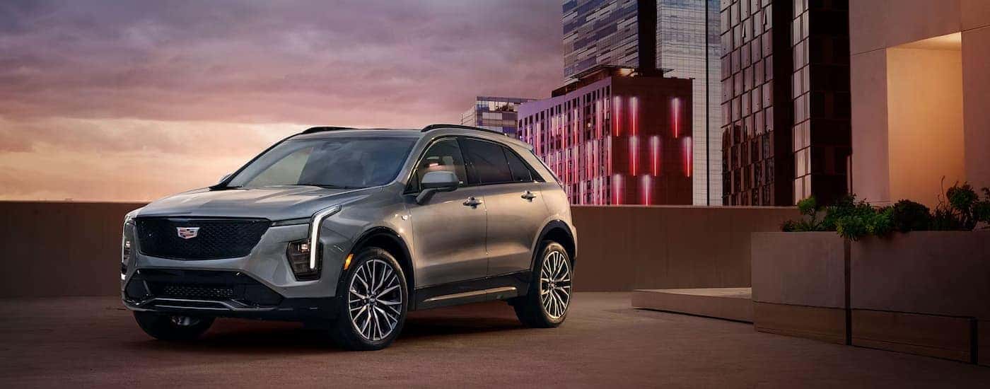 A silver 2025 Cadillac XT4 parked in a city
