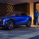 A person approached their blue 2026 Cadillac LYRIQ while charging