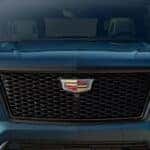 The front end of a green 2026 Cadillac Escalade.