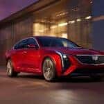 A red 2026 Cadillac CT5 for sale in Atlanta driving.