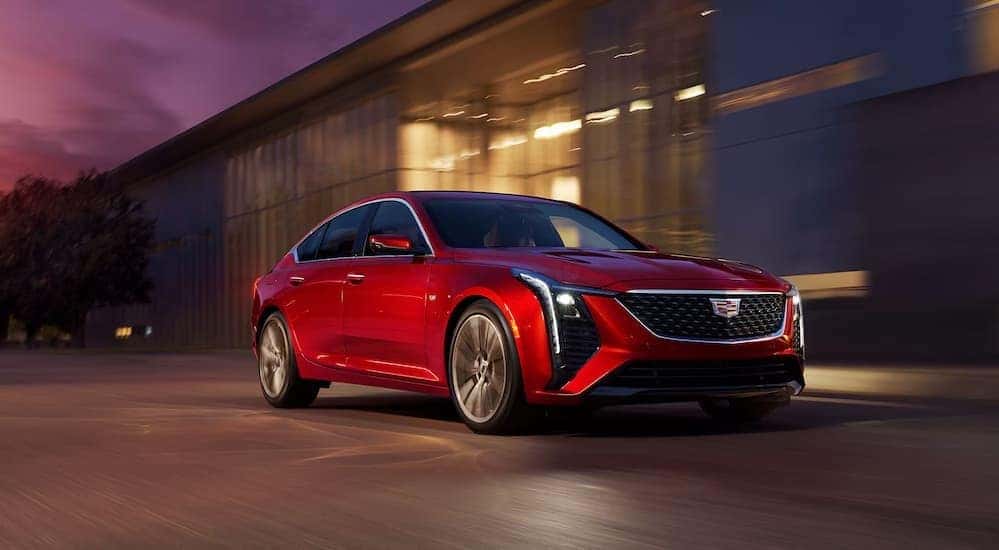 A red 2026 Cadillac CT5 for sale in Atlanta driving.