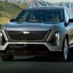 A silver 2026 Cadillac VISTIQ driving on a highway.