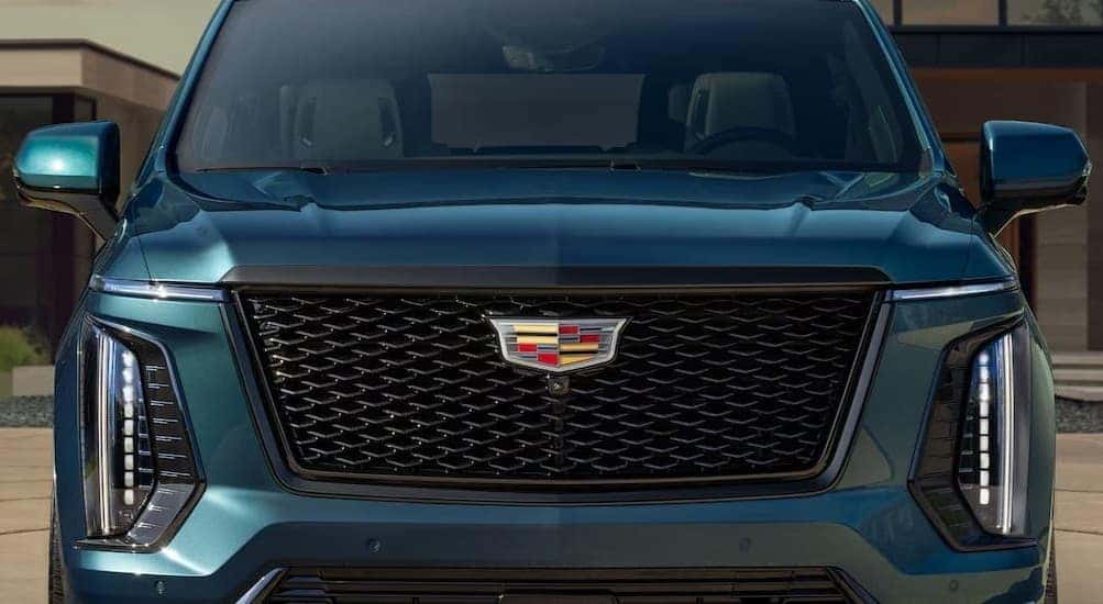 Close-up of the front end of a blue 2026 Cadillac Escalade for sale near Sandy Springs.