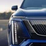Headlight and front fascia on a blue 2026 Cadillac VISTIQ