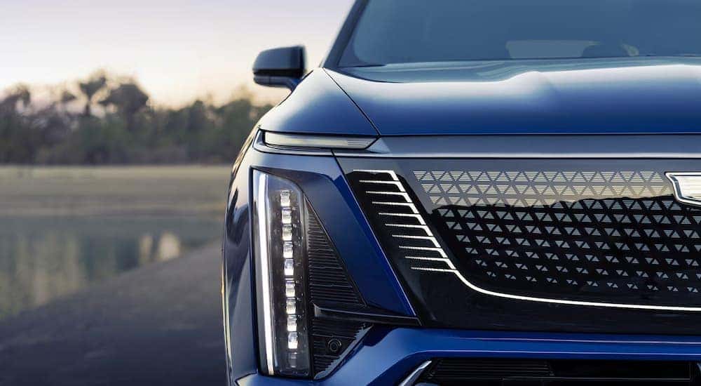 Headlight and front fascia on a blue 2026 Cadillac VISTIQ
