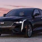 Black 2026 Cadillac CT4 parked at sunset