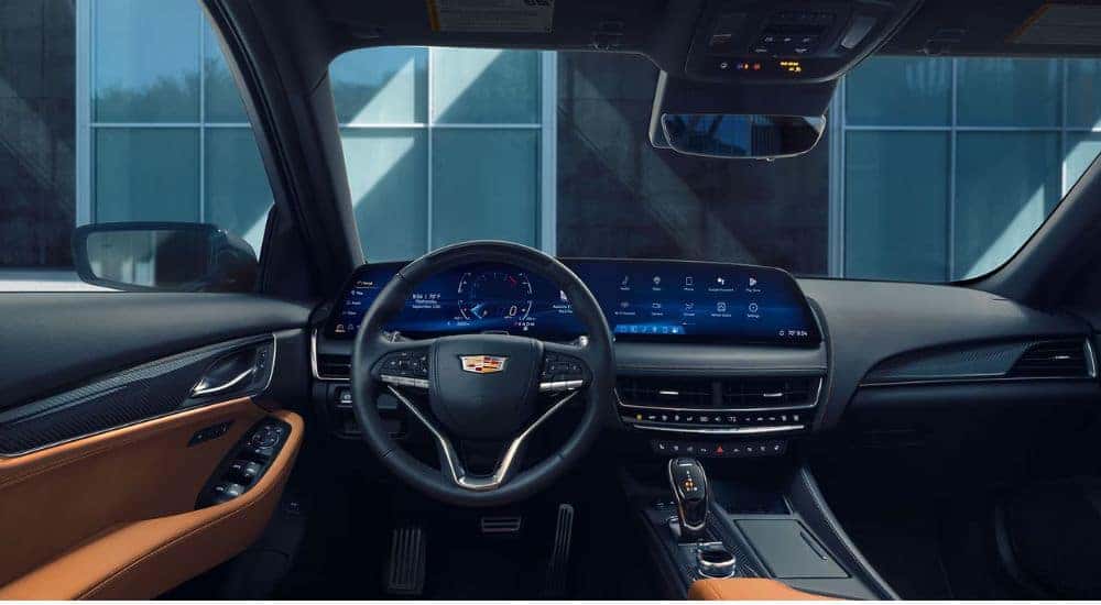 Interior view of a 2026 Cadillac CT5 parked in front of a building.