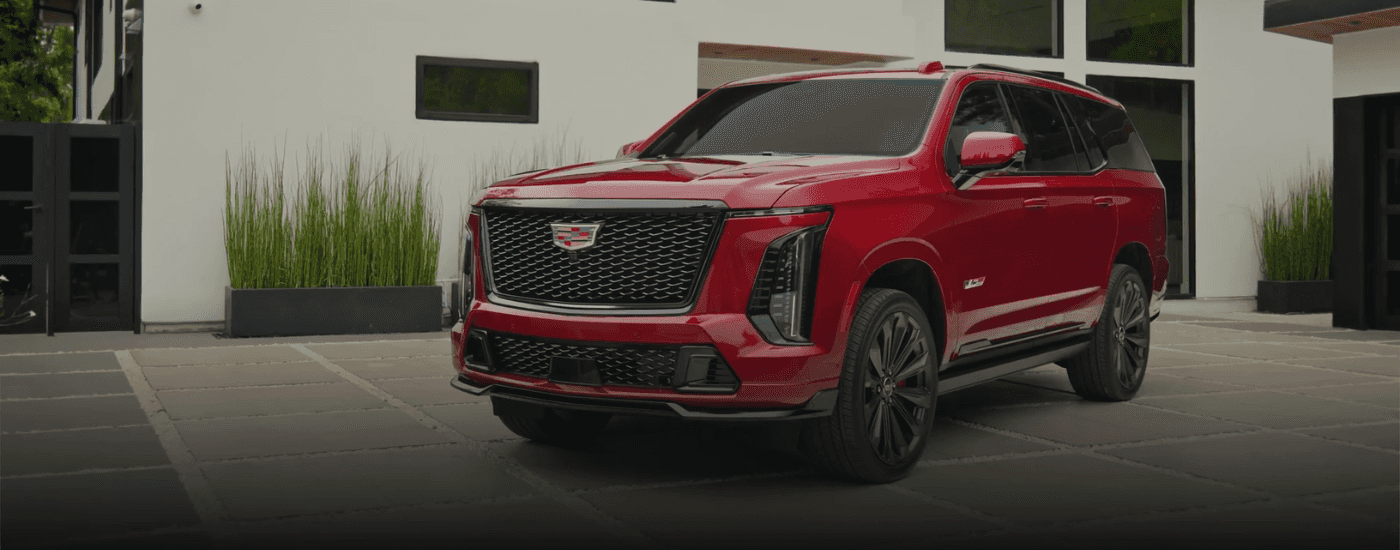 Red 2026 Cadillac Escalade parked in a driveway