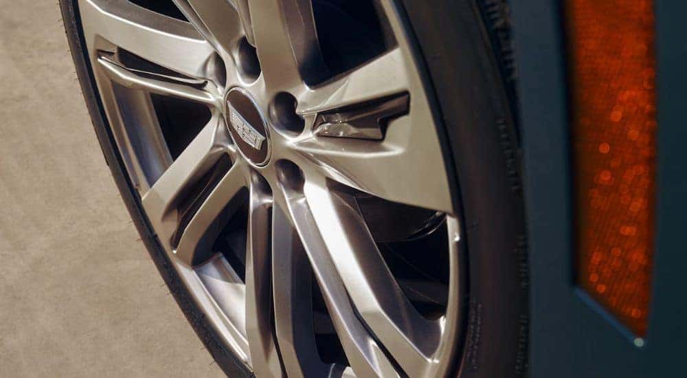Close up of a tire on a blue 2026 Cadillac Escalade.
