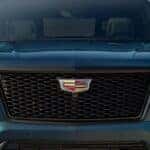 Front grille of a blue 2026 Cadillac Escalade.