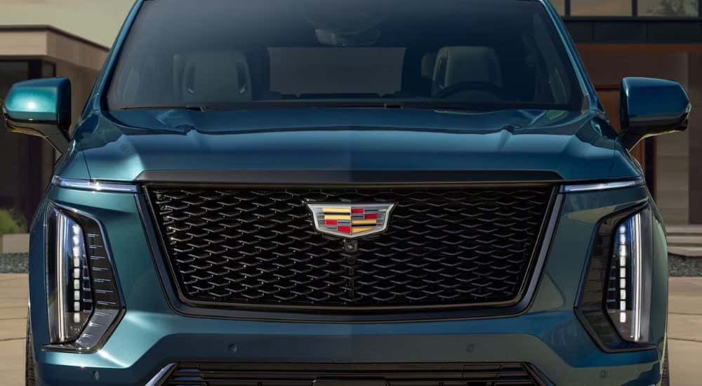 Front grille of a blue 2026 Cadillac Escalade.