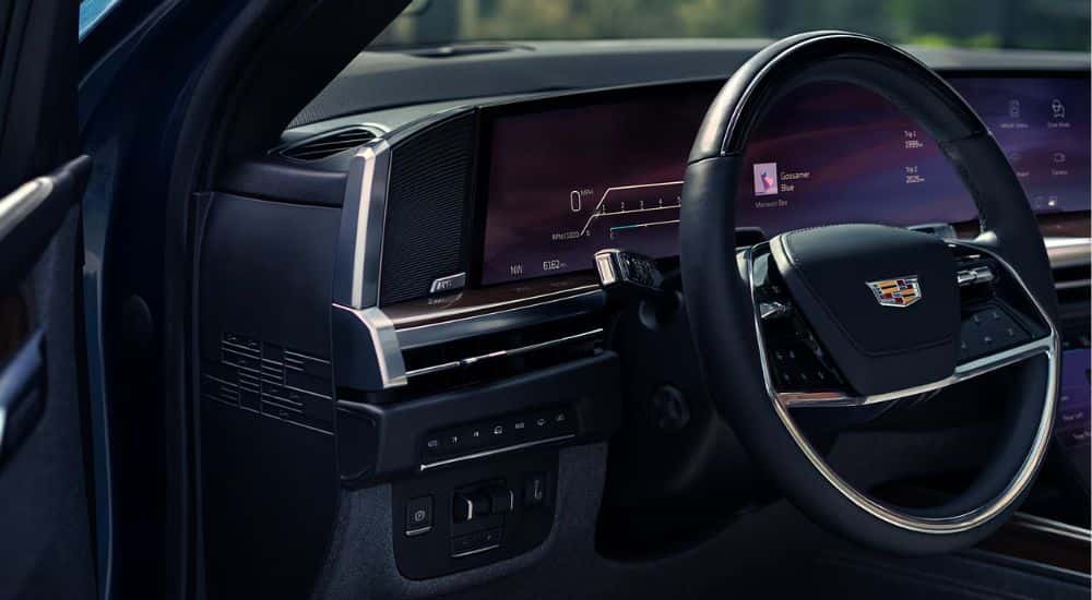 Interior view of a 2026 Cadillac Escalade steering wheel and infotainment.