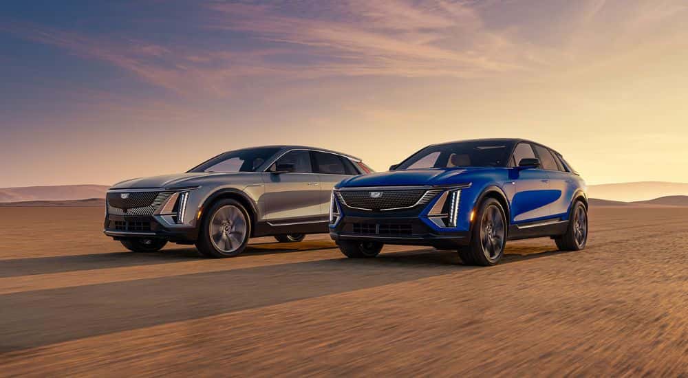 A grey and blue 2026 Cadillac LYRIQ parked in the desert.