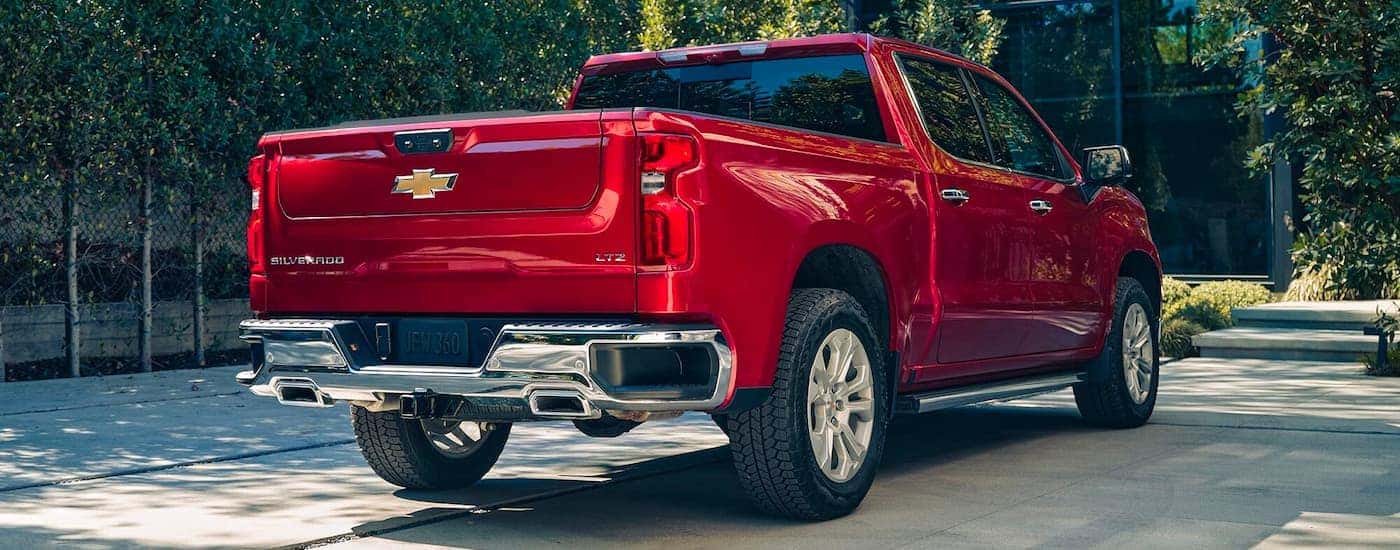 A red 2023 Chevy Silverado 1500 LTZ is shown from the rear.