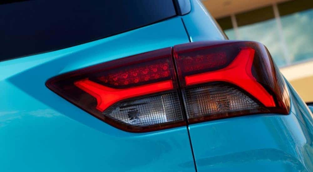 A close up shows the passenger side taillight on an aqua 2021 Chevy Trailblazer RS.