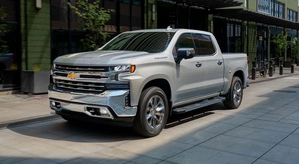 A grey 2019 Chevy Silverado 1500 is shown from the front at an angle.