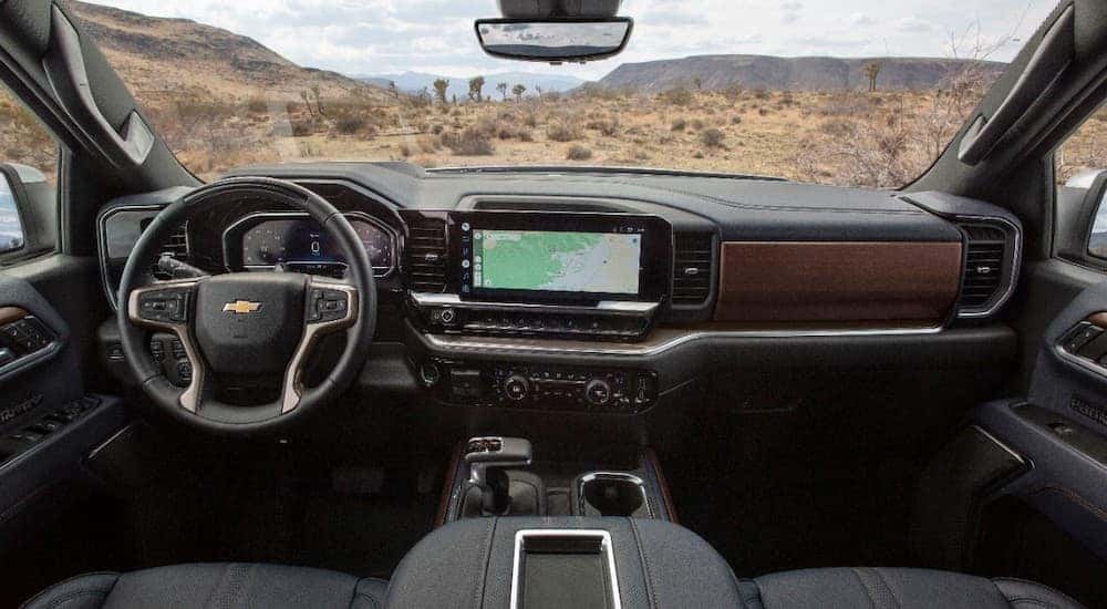 The black dash of a 2022 Chevy Silverado 1500 High Country is shown from above the center console.