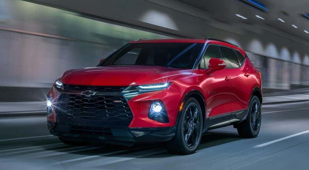 A red 2024 Chevy Blazer RS is shown from the front at an angle after leaving a Smyrna Chevy dealer.