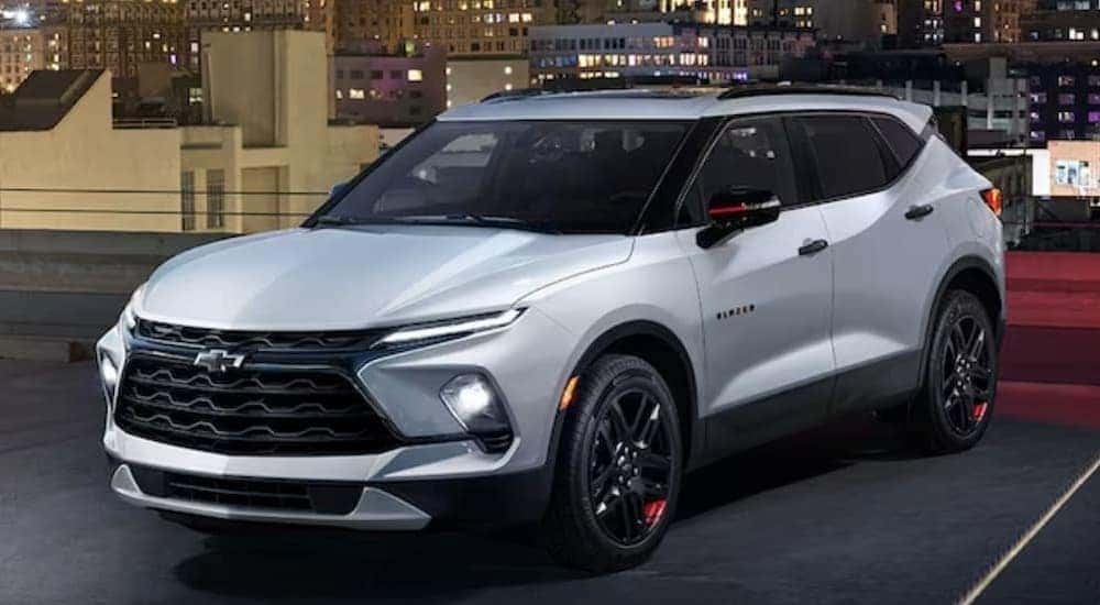 A white 2024 Chevy Blazer is shown parked.