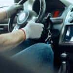 A mechanic is shown sitting in the driver's seat of a car during an auto service near Sandy Springs.