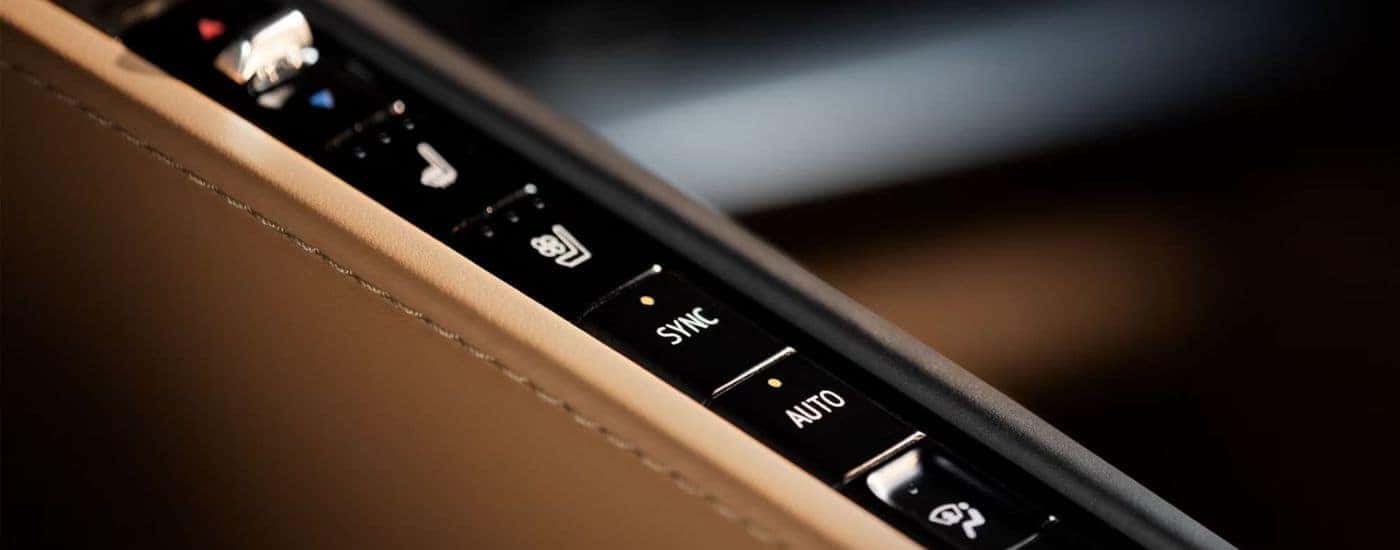 A close up shows buttons in a 2024 Chevy Corvette Stingray.