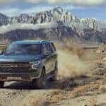 A silver 2024 Chevy Tahoe Z71 is shown from the front at an angle.