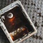 A pan of transmission fluid is shown during an auto service near Johns Creek.