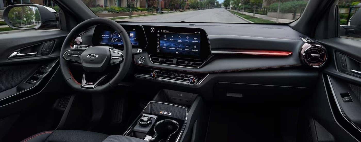 The black interior and dash in a 2025 Chevy Equinox is shown.