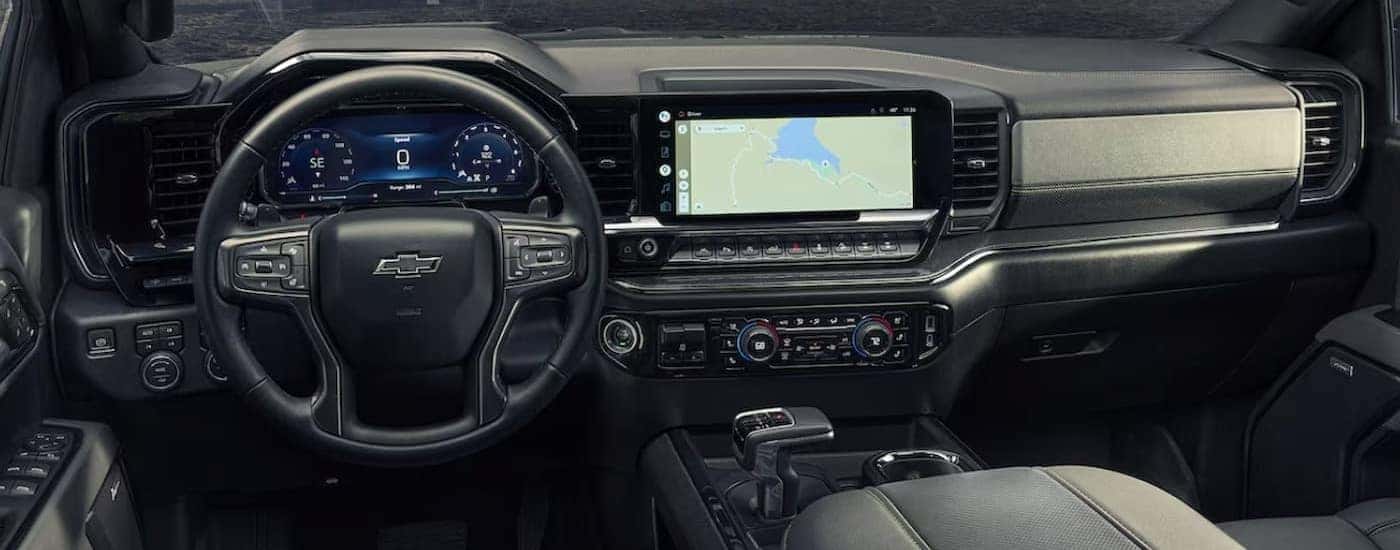 The black interior and dash in a 2024 Chevy Silverado 1500 is shown.