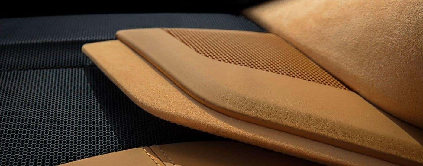 A close-up shows tan interior details in 2025 Chevy Corvette Stingray.