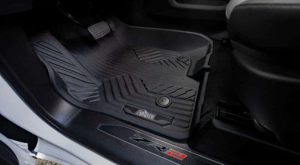 A close up shows all-weather floor mats in a white 2024 Chevy Silverado 1500 ZR2 Bison.