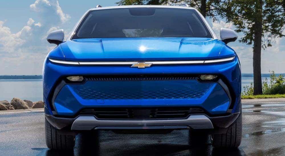 A front angle view of a blue 2025 Chevy Equinox EV for sale.