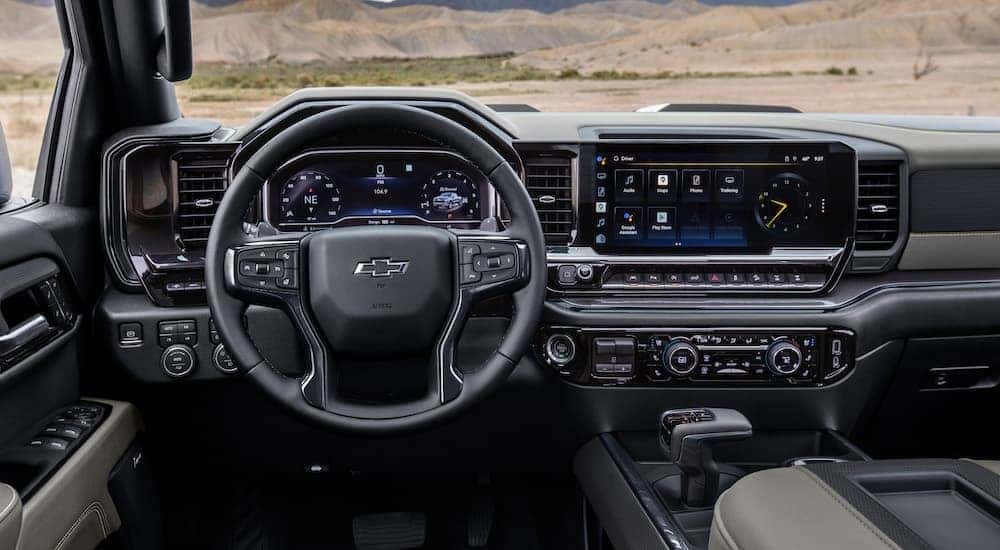 The black interior of a 2025 Chevy Silverado 1500 ZR2 is shown from the driver's seat.
