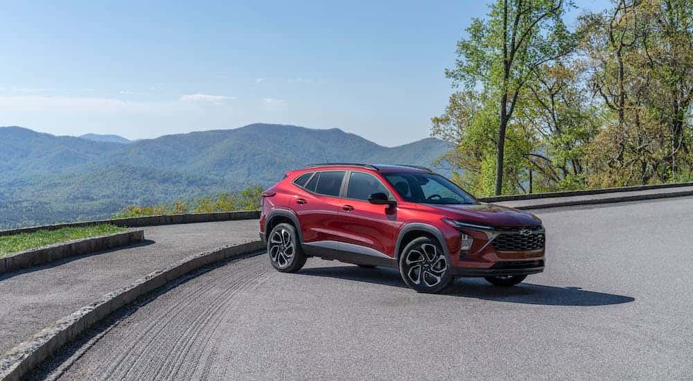 A red 2025 Chevy Trax RS is shown from the side.