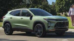 A green 2025 Chevy Trax for sale parked and angled right.