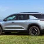 A silver 2025 Chevy Traverse Z71 is shown from the side.