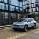 A silver 2025 Chevy Equinox for sale is shown from the front at an angle.
