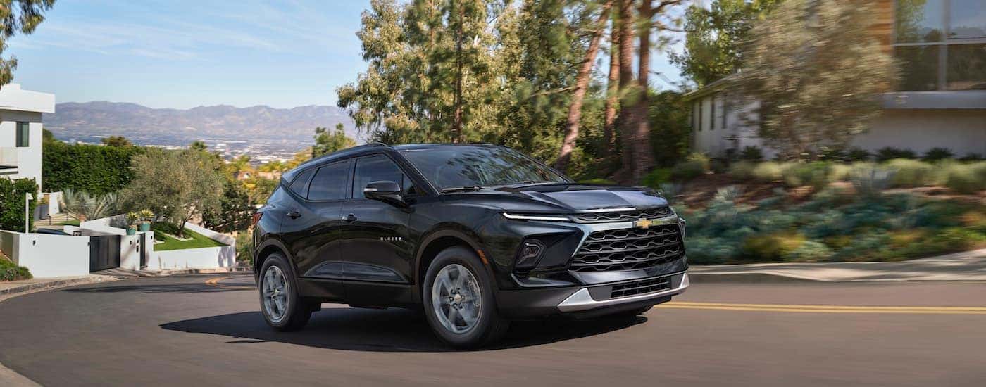A grey 2025 Chevy Blazer is shown from the front at an angle.