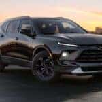 A black 2025 Chevy Blazer parked at a Chevy dealer near Snellville.
