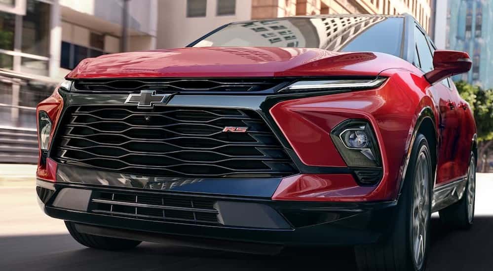 Close-up of the grille on a red 2025 Chevy Blazer RS.