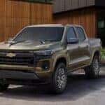 A green 2025 Chevy Colorado parked on a driveway.